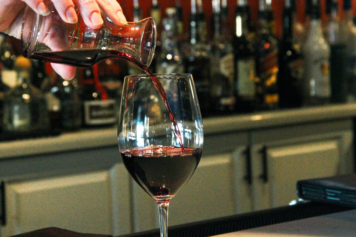 glass of wine being poured