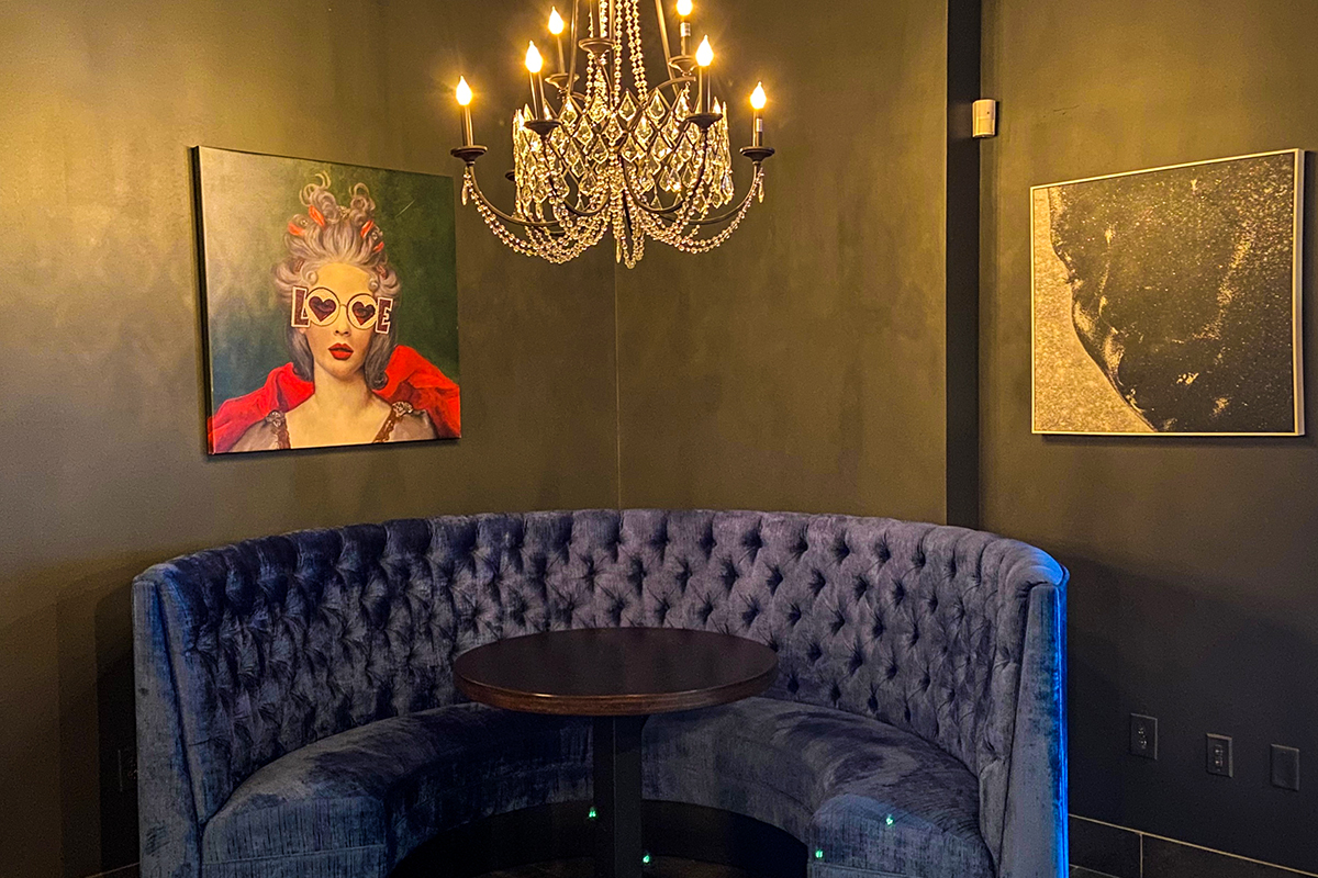 velvet booth and sparkling crystal chandelier